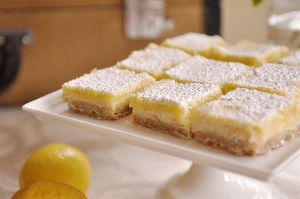 lemon cream cheese bars dusted with powdered sugar