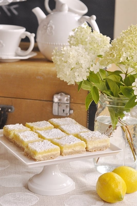 lemon cheesecake bars on a tea party table