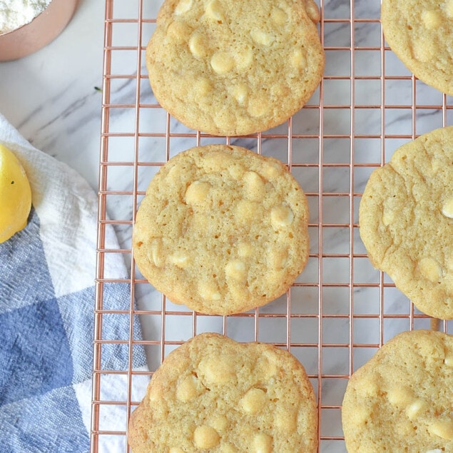 lemon white chocolate chip cookies on a cooling rack