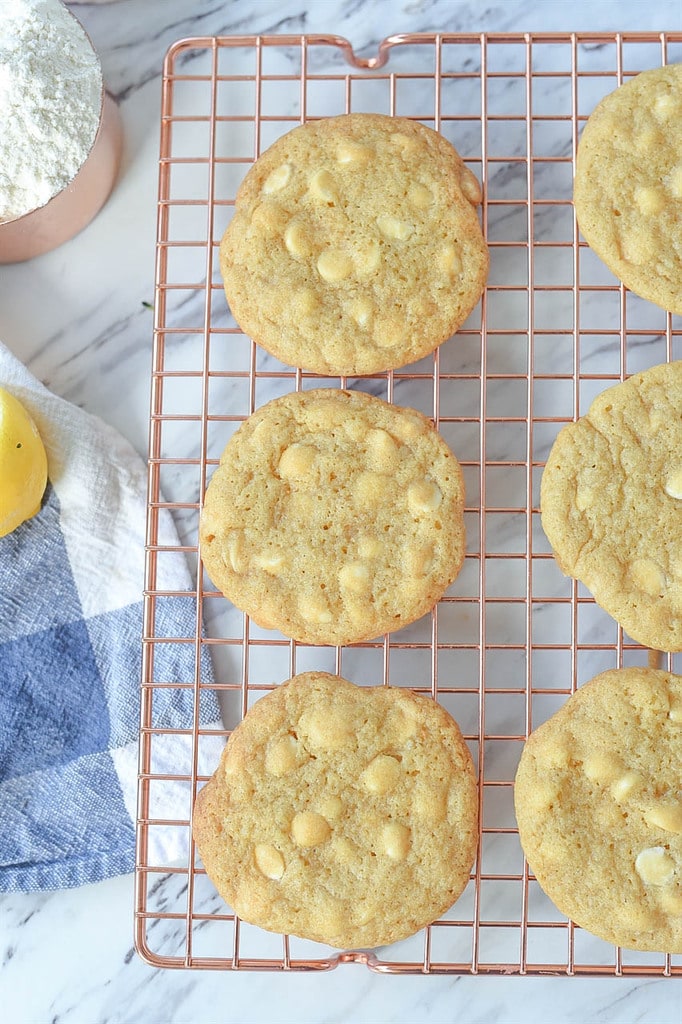 lemon white chocolate chip cookies on a cooling rack
