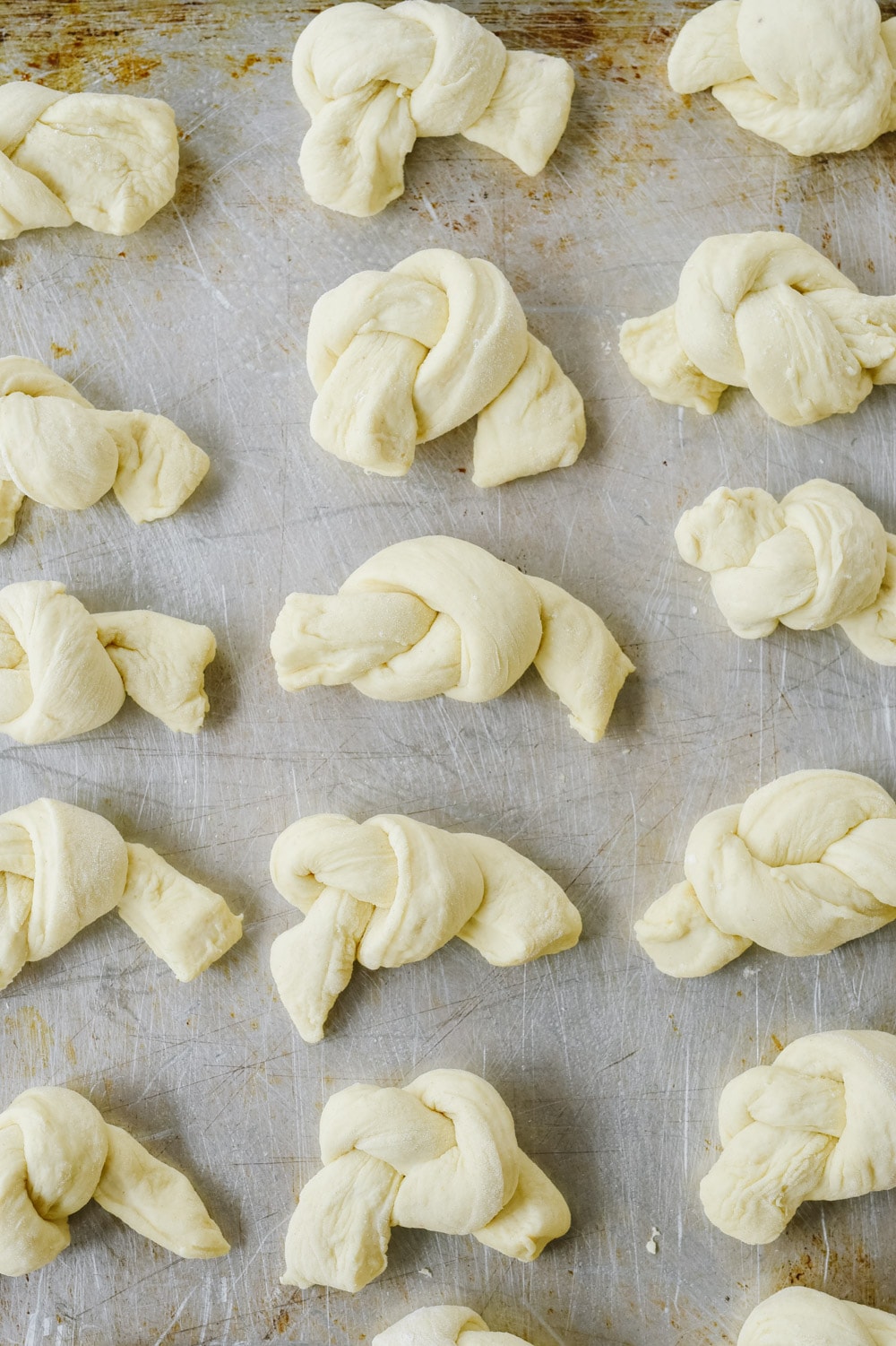 garlic knot dough on a baking sheet