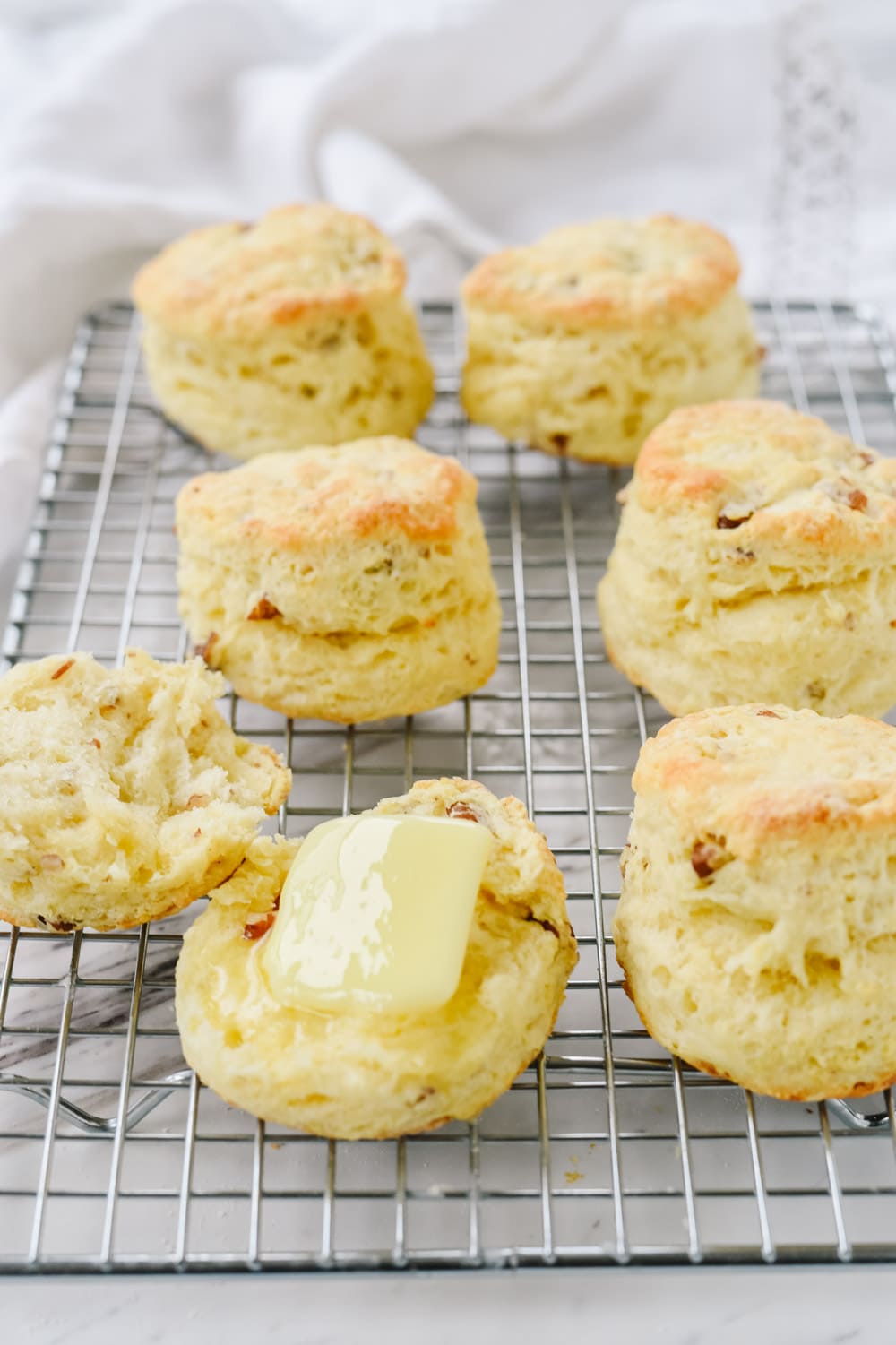 sour cream biscuits on a cooling rack