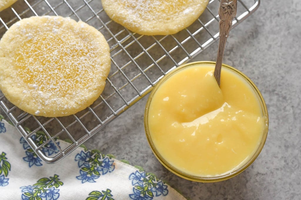 bowl of key Lime Curd and lime cookies on cooling rack