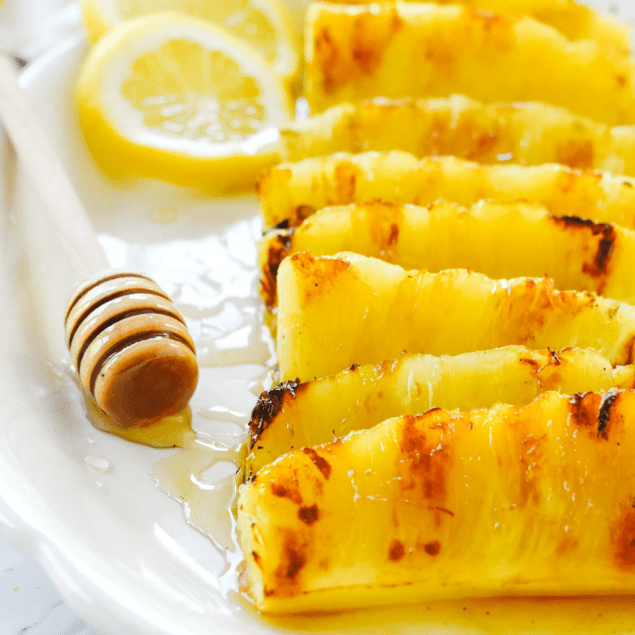 grilled pineapple spears on a plate