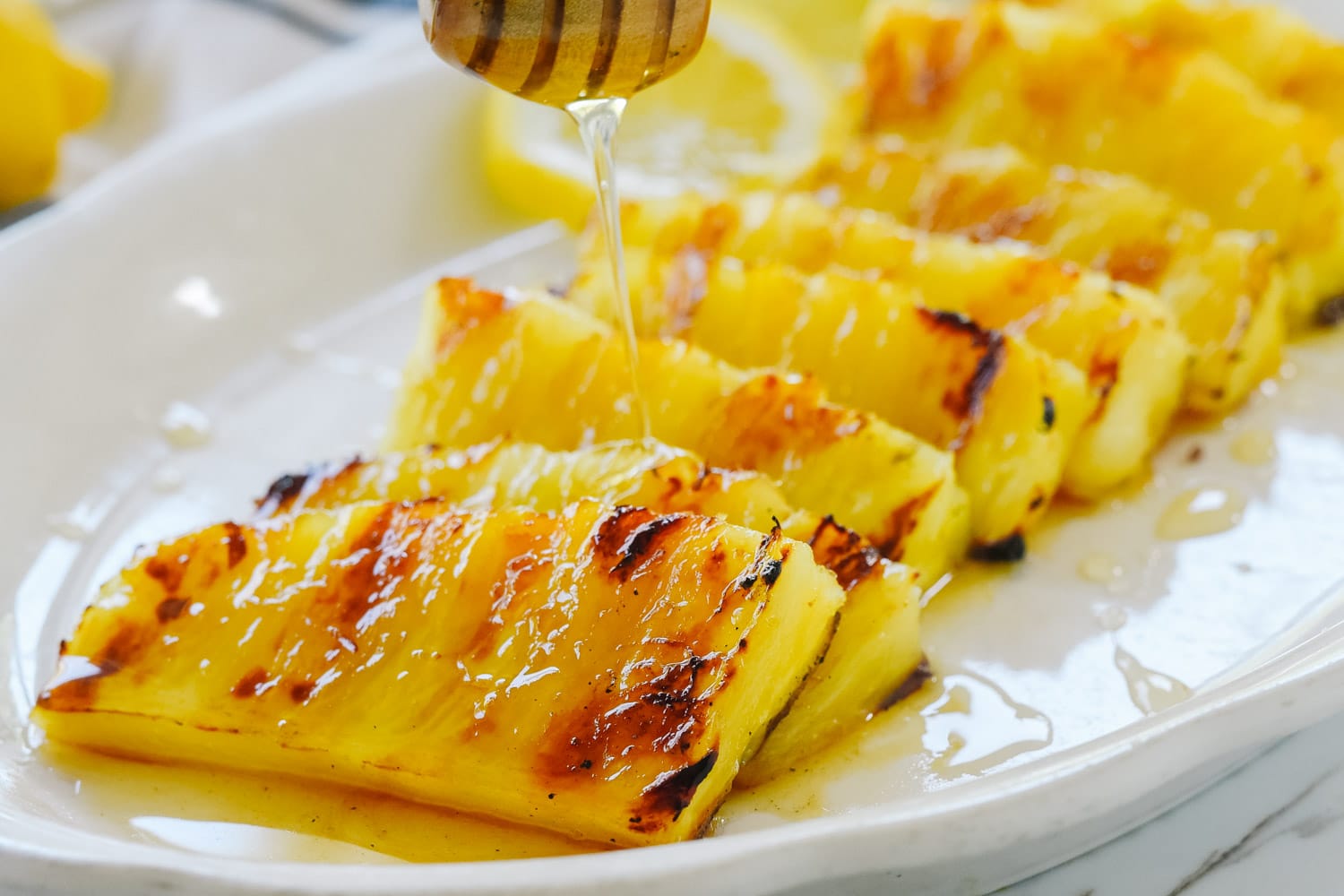 Drizzling honey on pineapple