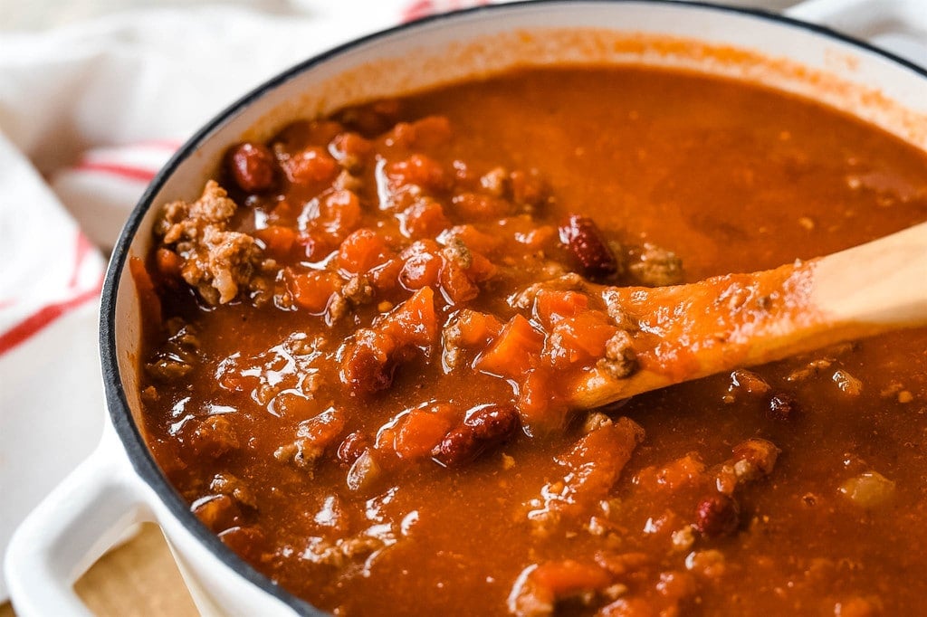 stirring taco Soup in a cast iron pot