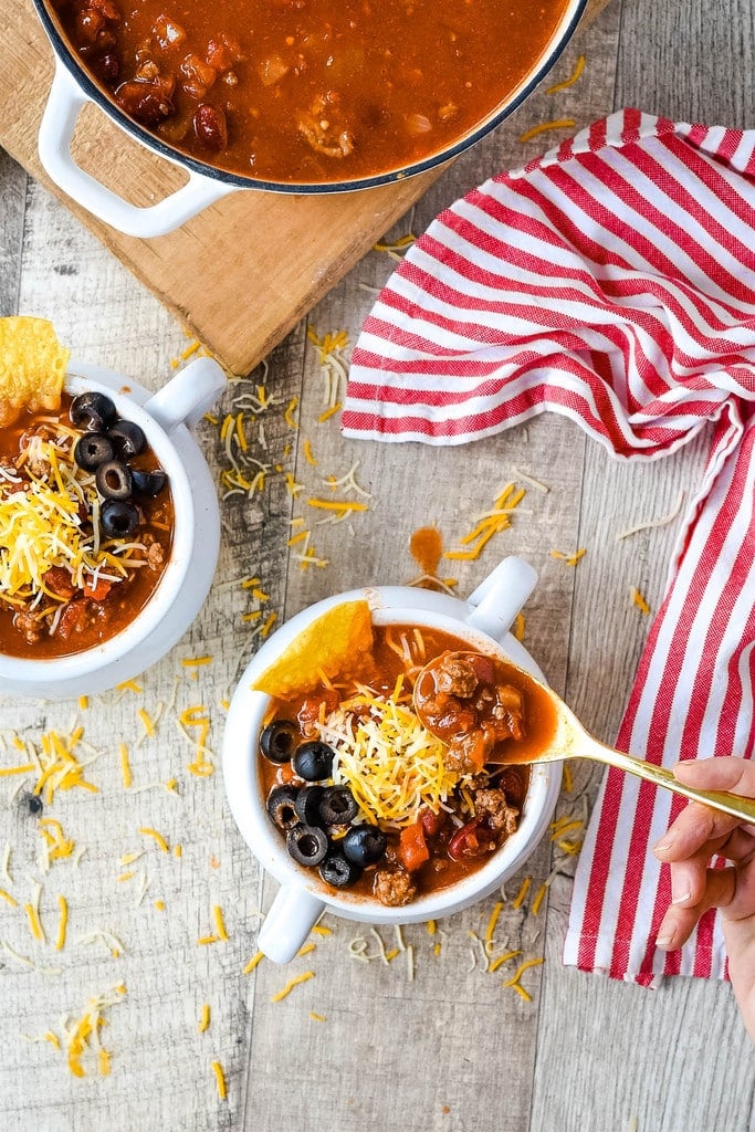 eating taco soup out of a bowl with a gold spoon