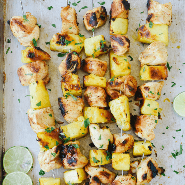 chicken pineapple skewers on a tray