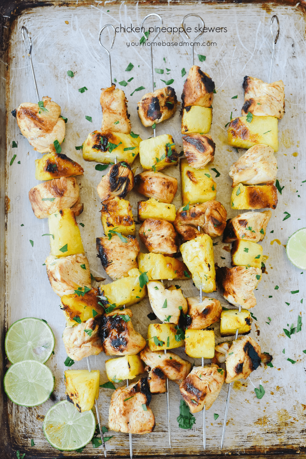 chicken pineapple skewers on a tray