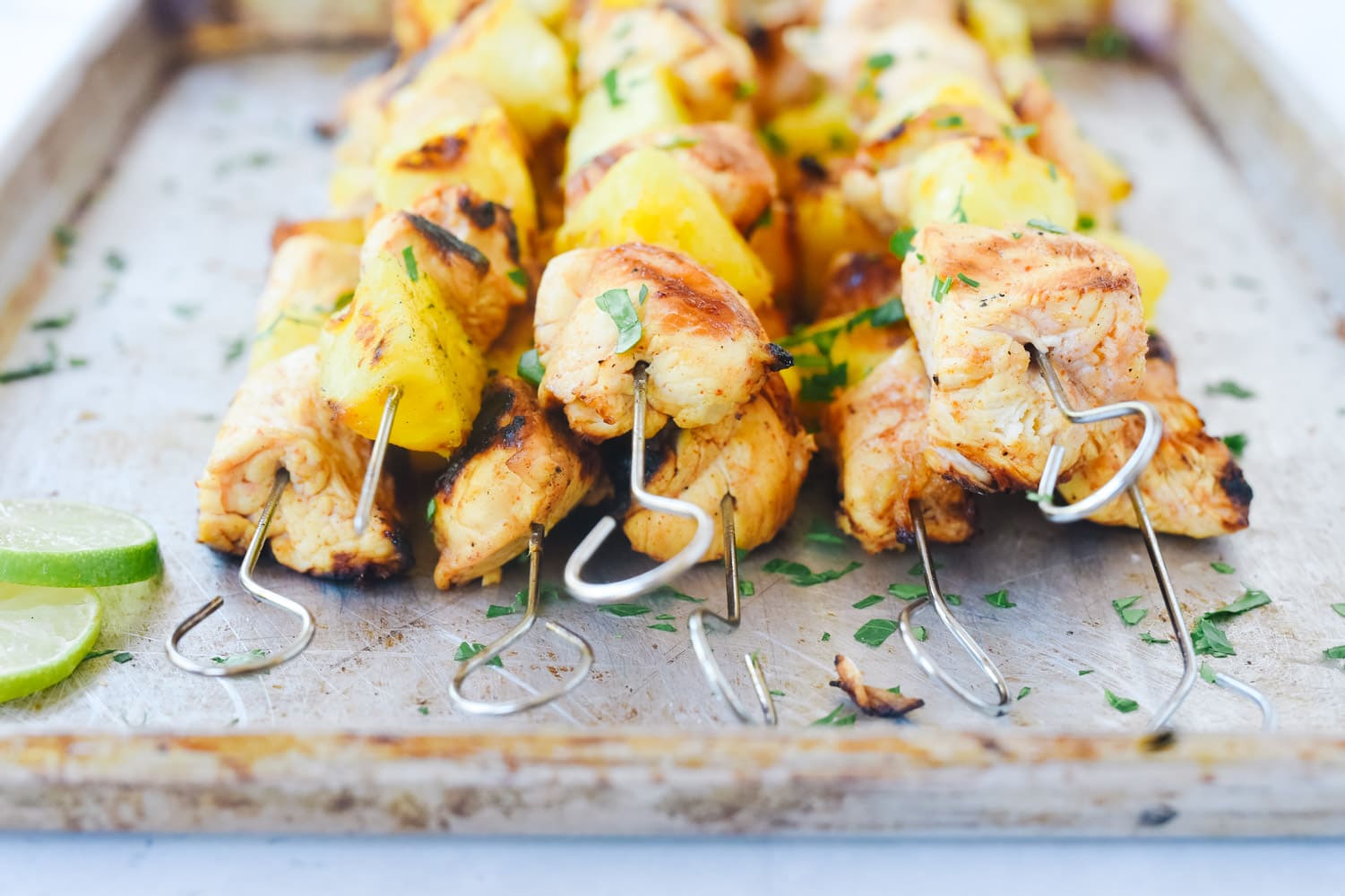 Chili Lime Pineapple Chicken Skewers on a tray