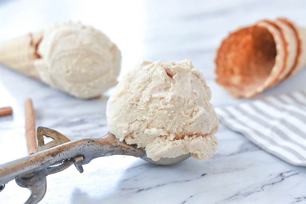 scooping homemade cinnamon ice cream