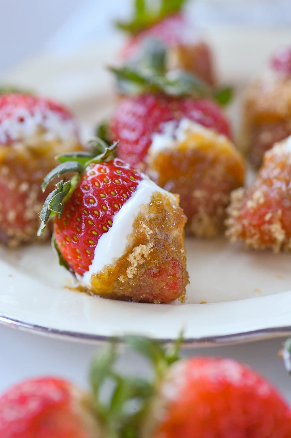 Strawberry dipped in sour cream and brown sugar