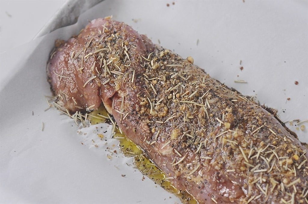 pork tenderloin covered in herbs and balsamic vinegar