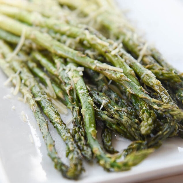 roasted asparagus with parmesan cheese on top
