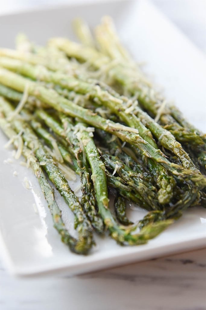 roasted asparagus with parmesan cheese on top
