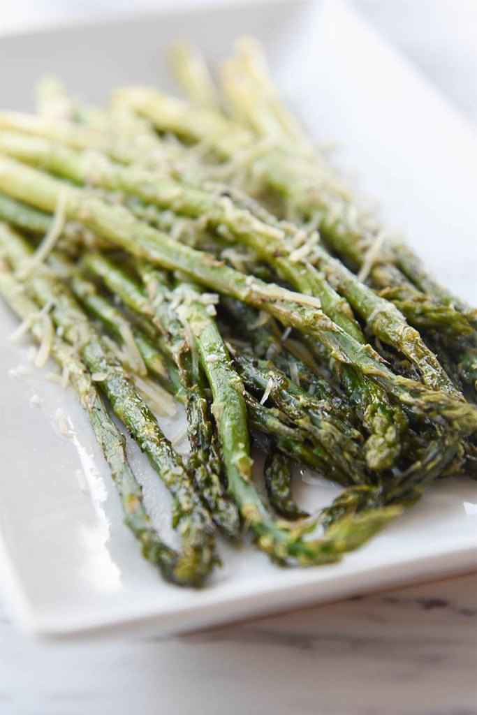 roasted asparagus with parmesan cheese on top