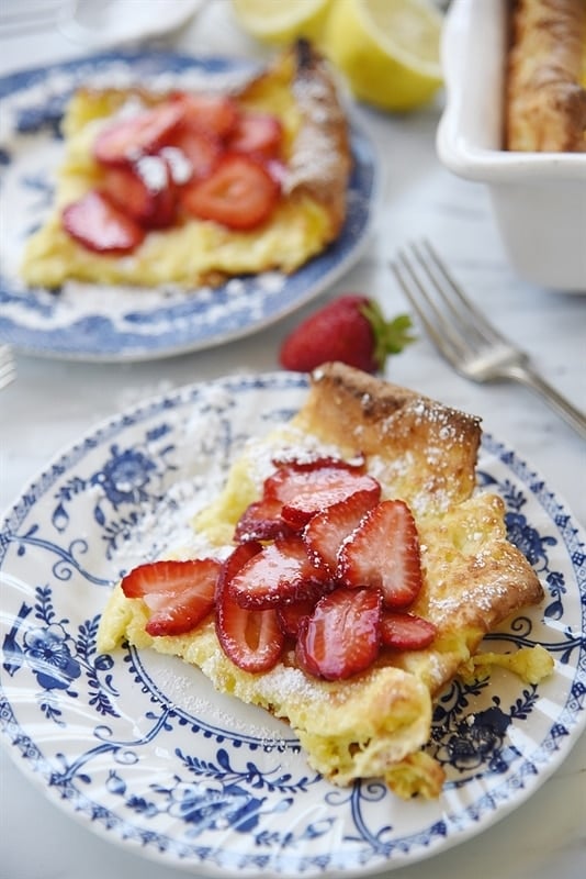 Puff Up Pancakes strawberries powdered sugar