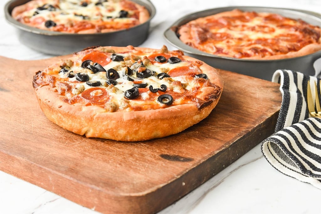 Three Deep Dish Pizzas