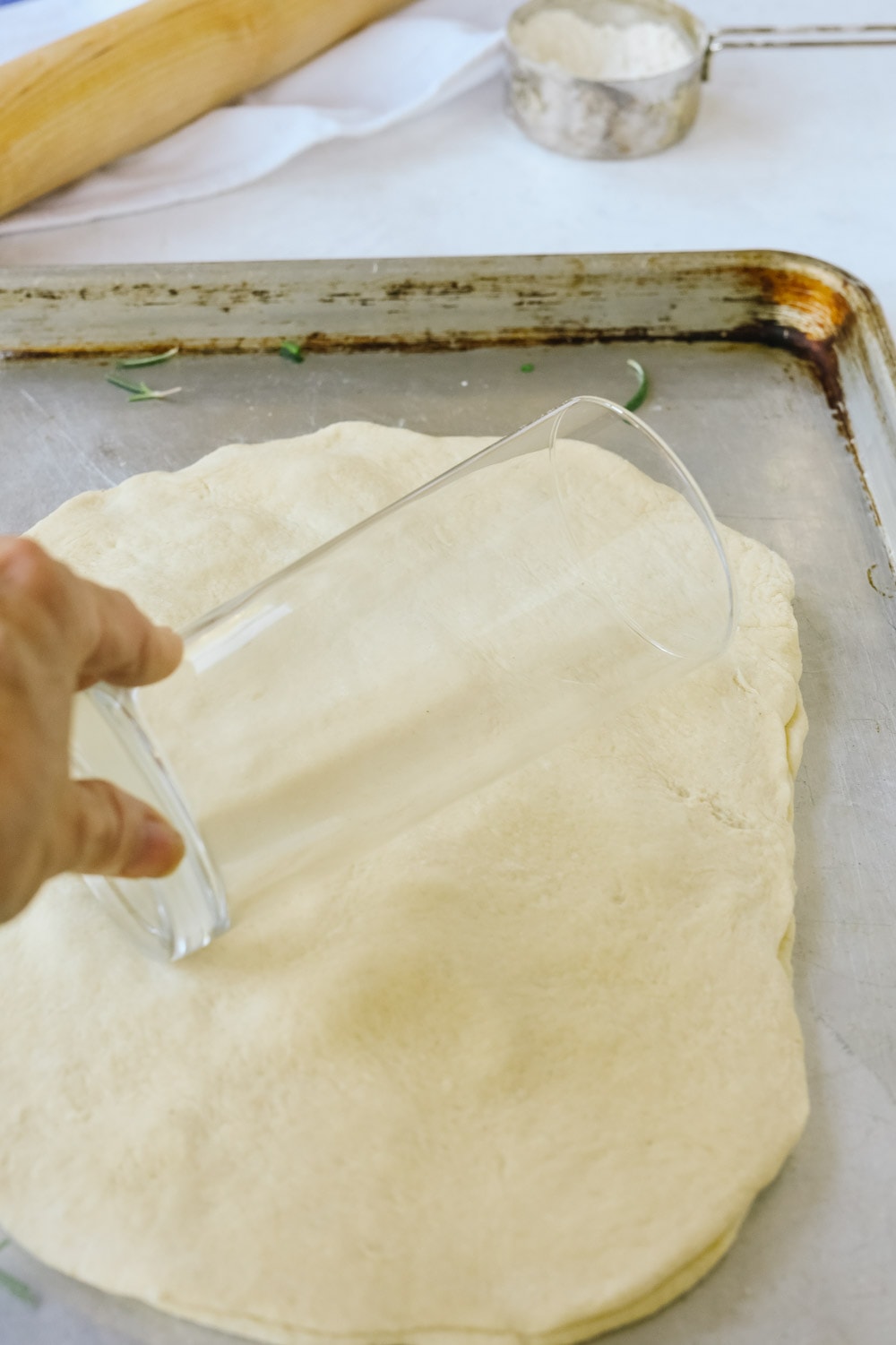rolling out herb flatbread
