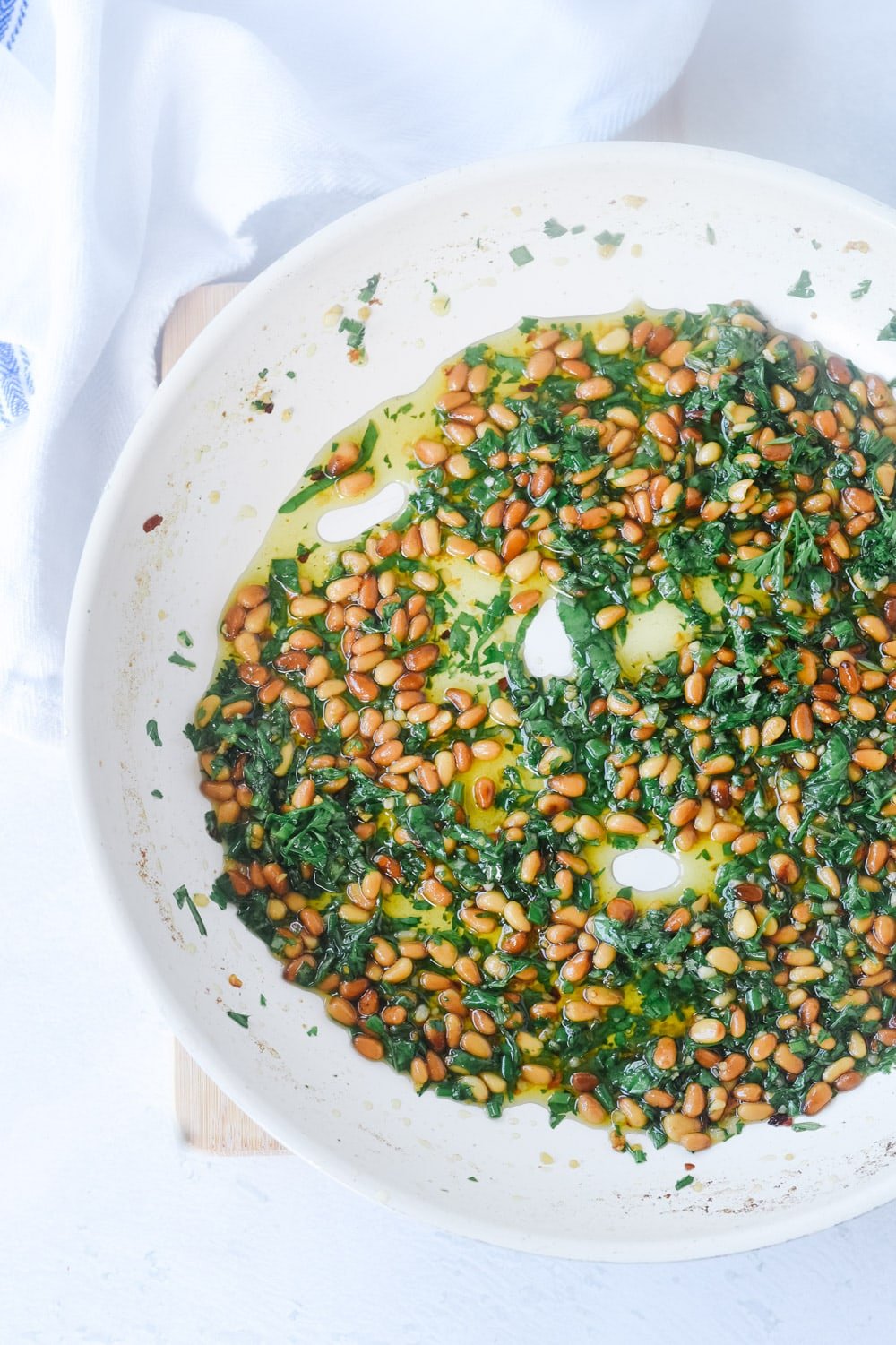 nuts and herbs in a pan