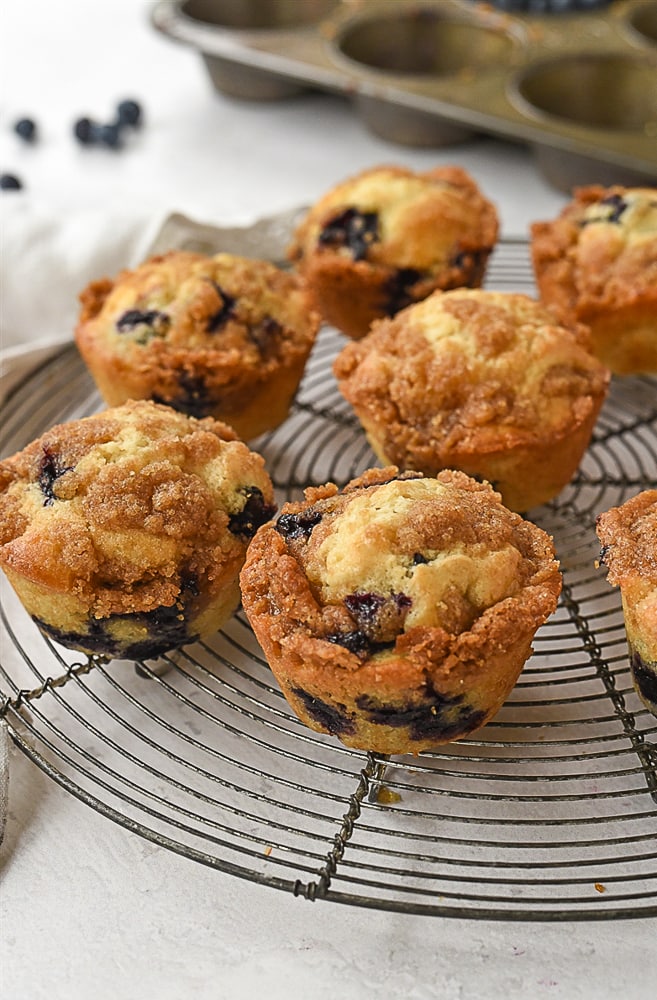 blueberry muffins on a cooling rack