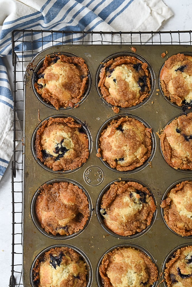 Streusel blueberry muffins ovehead shot of streusel topped blueberry muffins