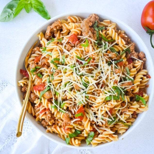 sausage and tomato pasta in a bowl