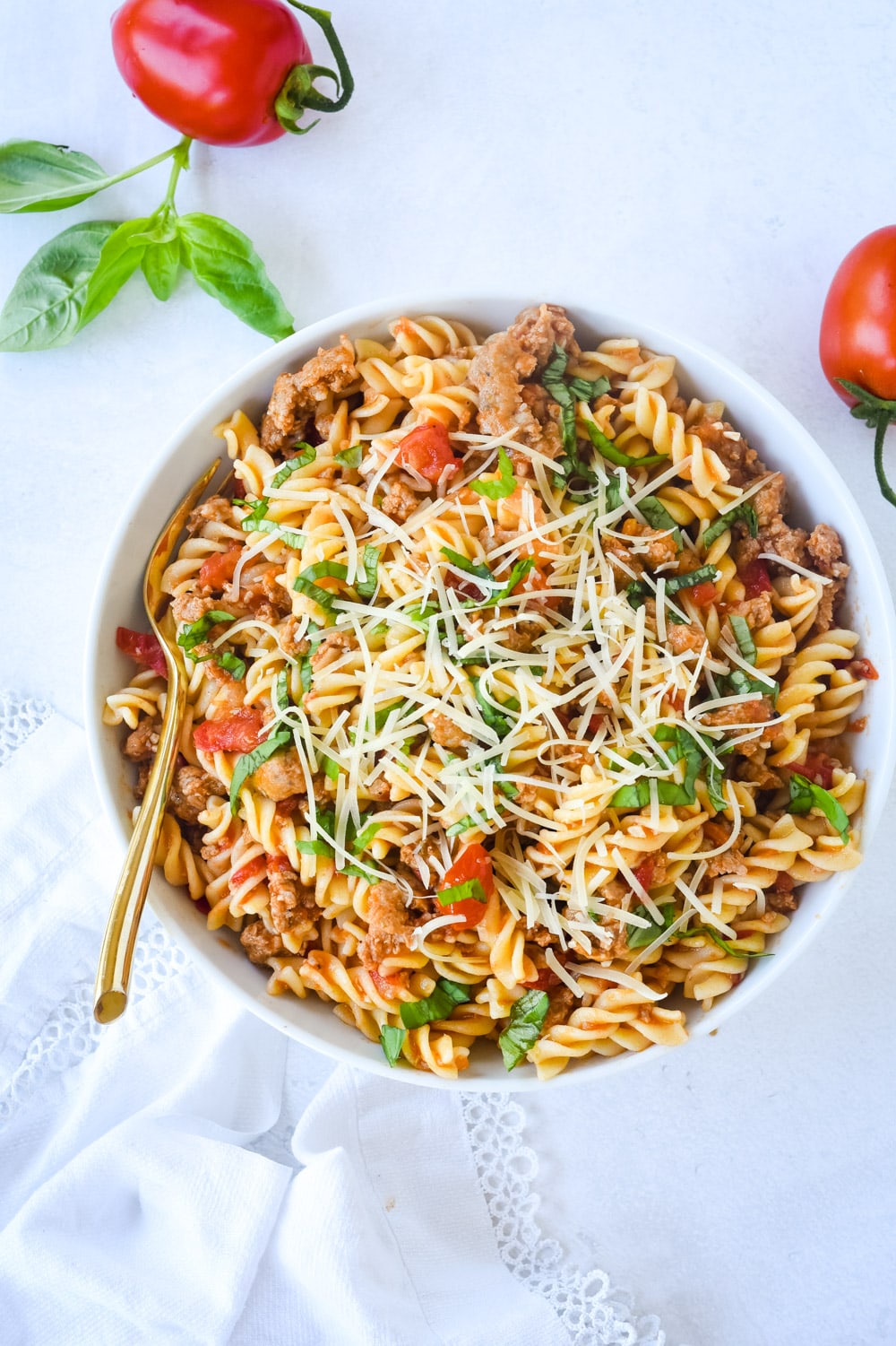 sausage and tomato pasta in a bowl