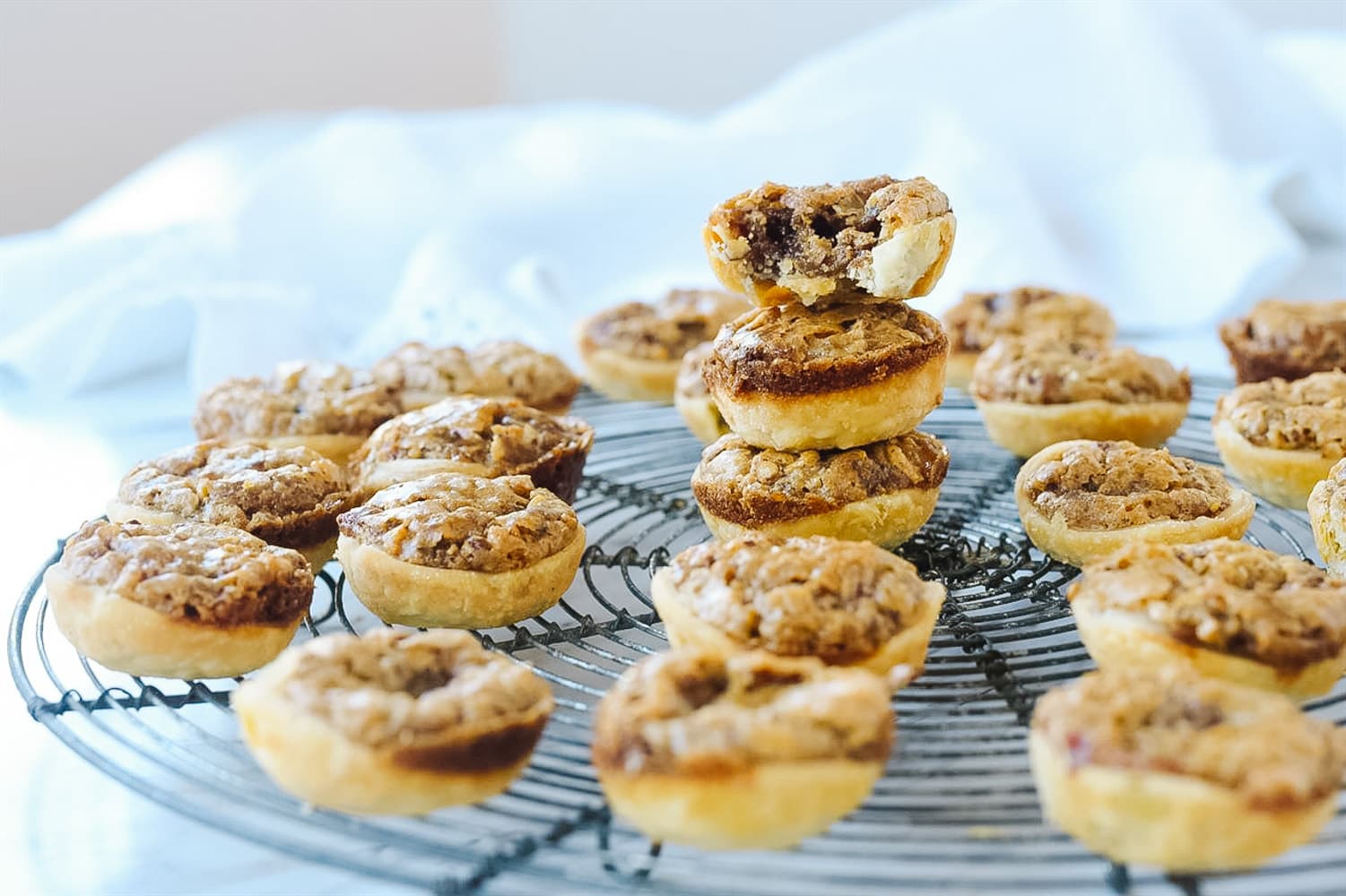 pecan tassies on a cooling rack