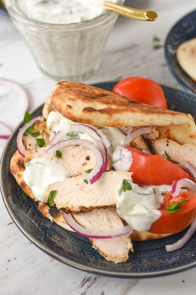 Chicken Gyro with tomato onions and tzatziki sauce