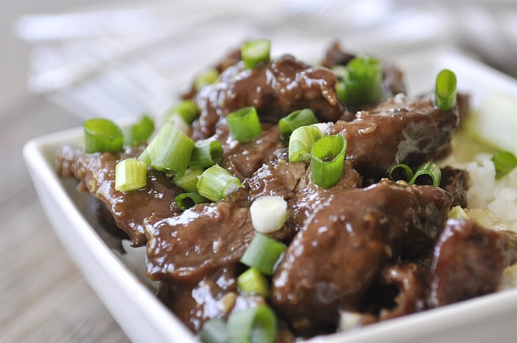 close up of Mongolian beef over rice