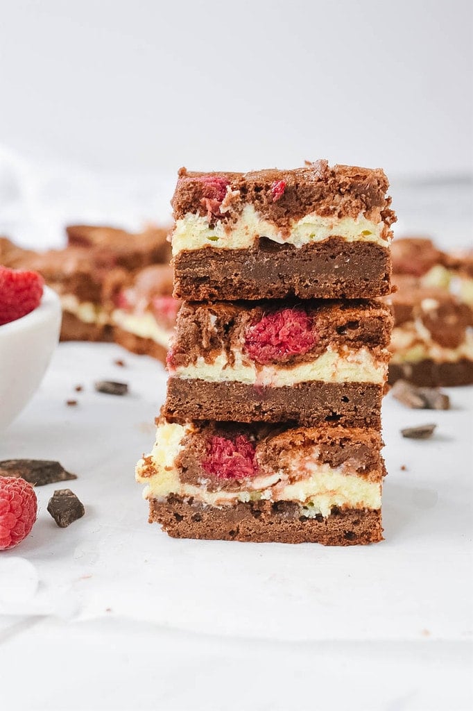 raspberry cream cheese brownies in a stack