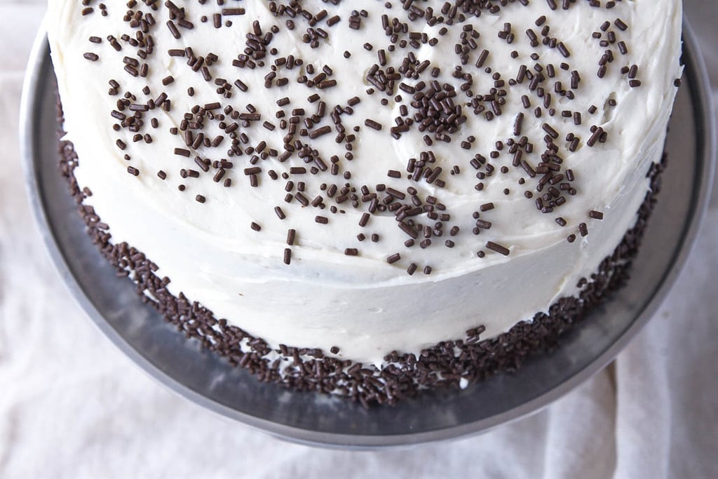 chocolate cake on a silver cake plate