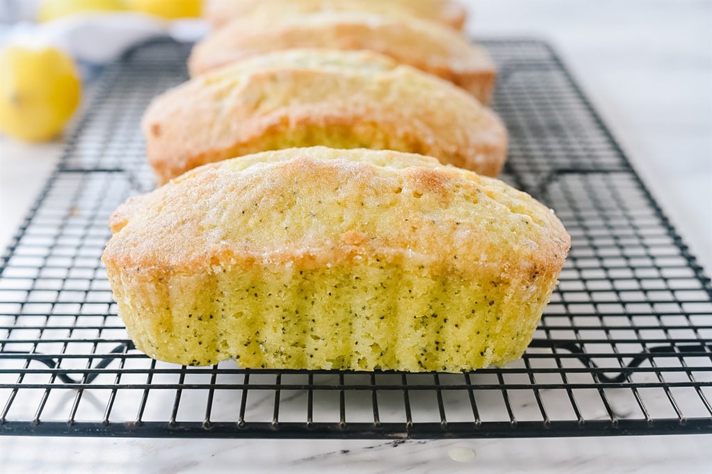 Lemon poppy seed bread on a cooling rack