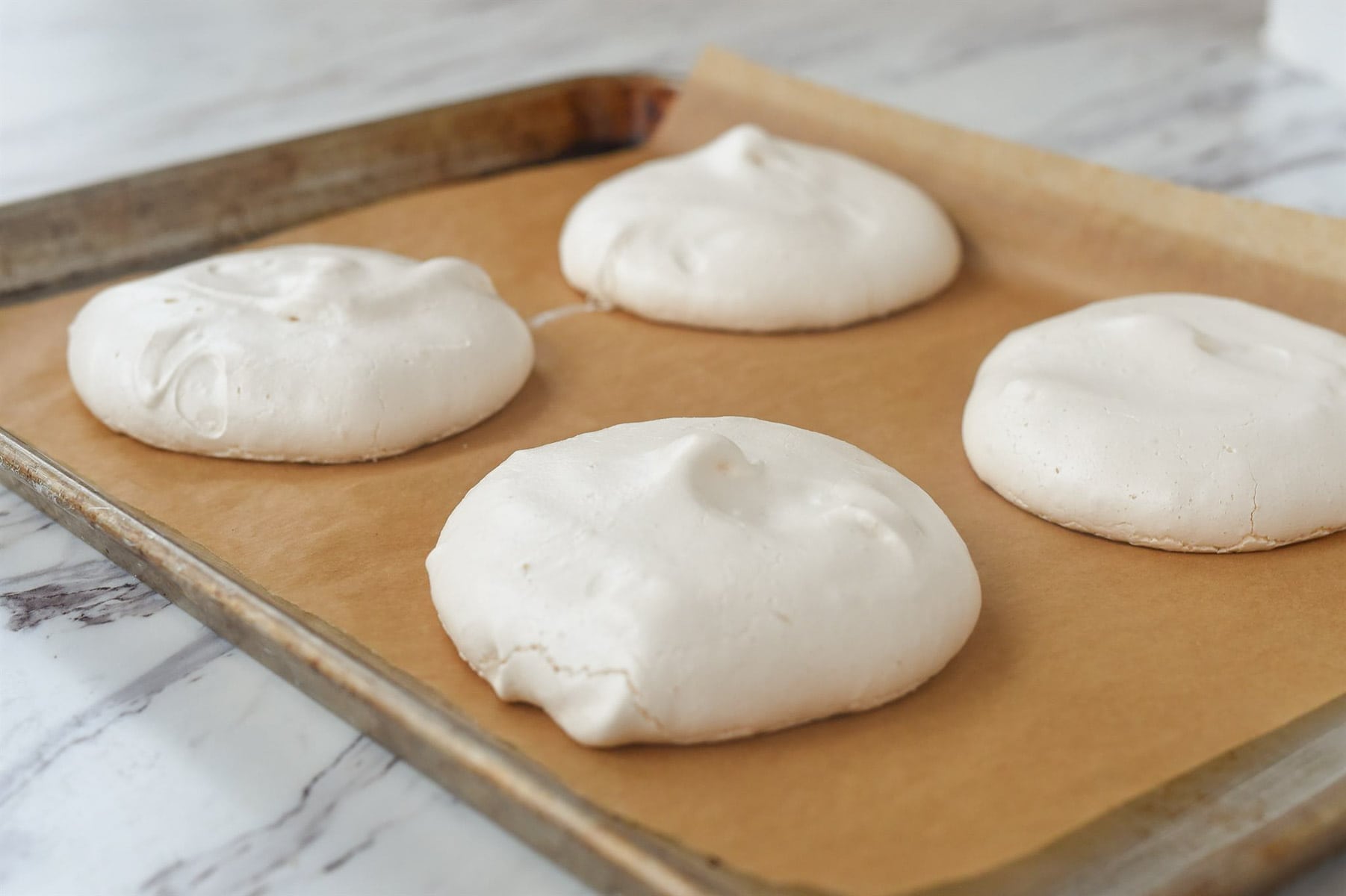 baked meringues on a baking sheet