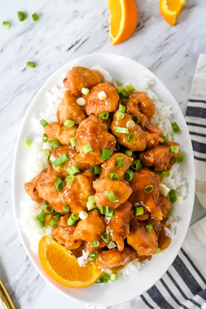 platter of orange chicken and white rice