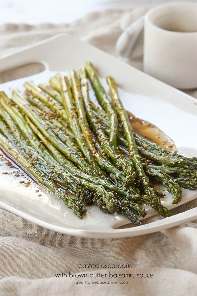 balsamic asparagus on a white serving tray