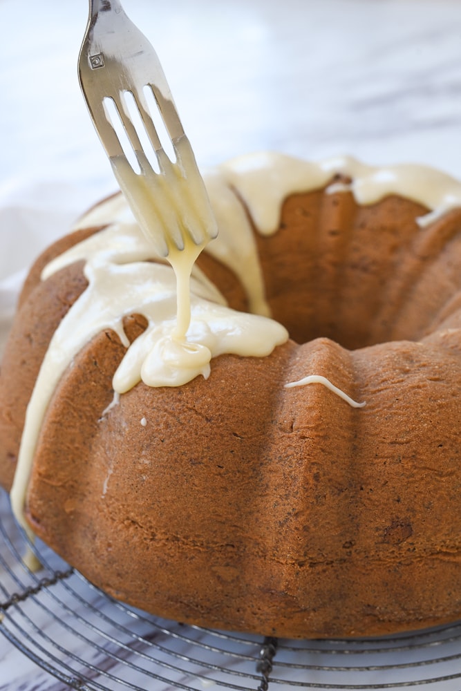 glazing cake with a fork