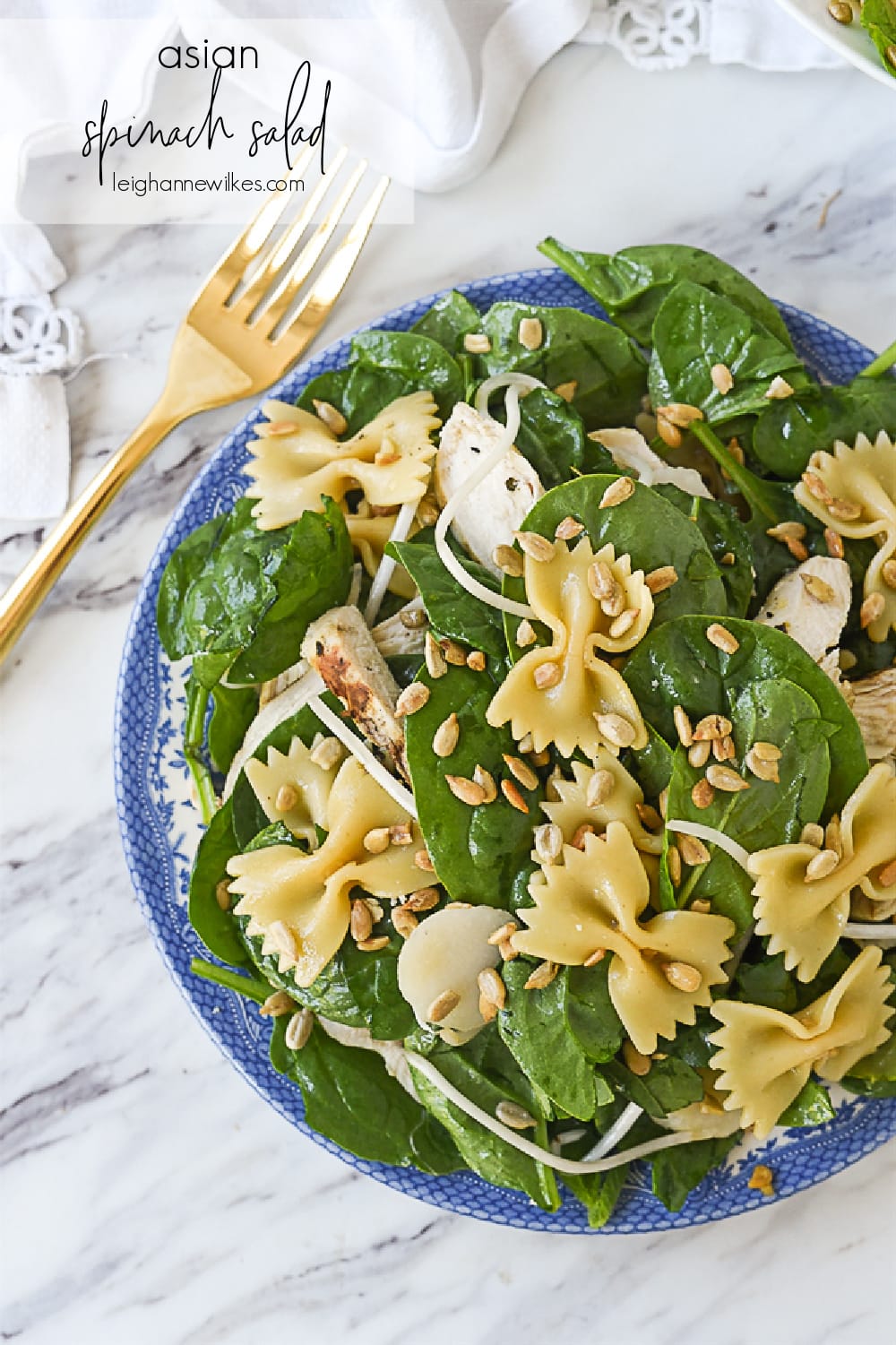 asian spinach salad in a bowl