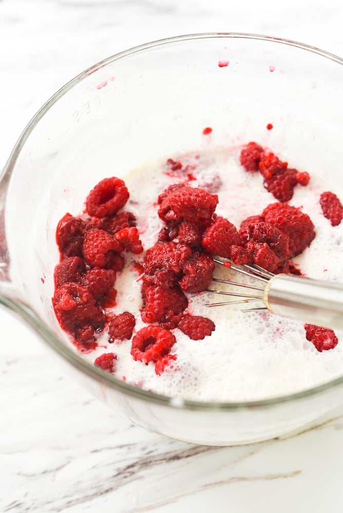 bowl of milk and raspberries