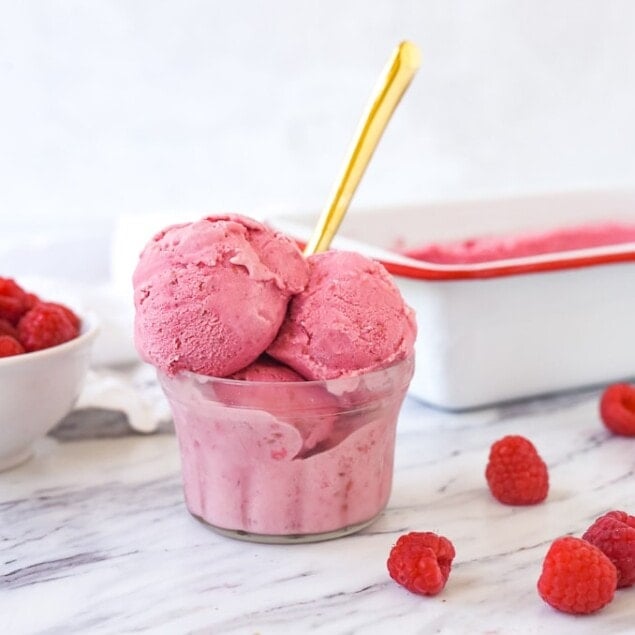 bowl of raspberry ice cream with a spoon in it