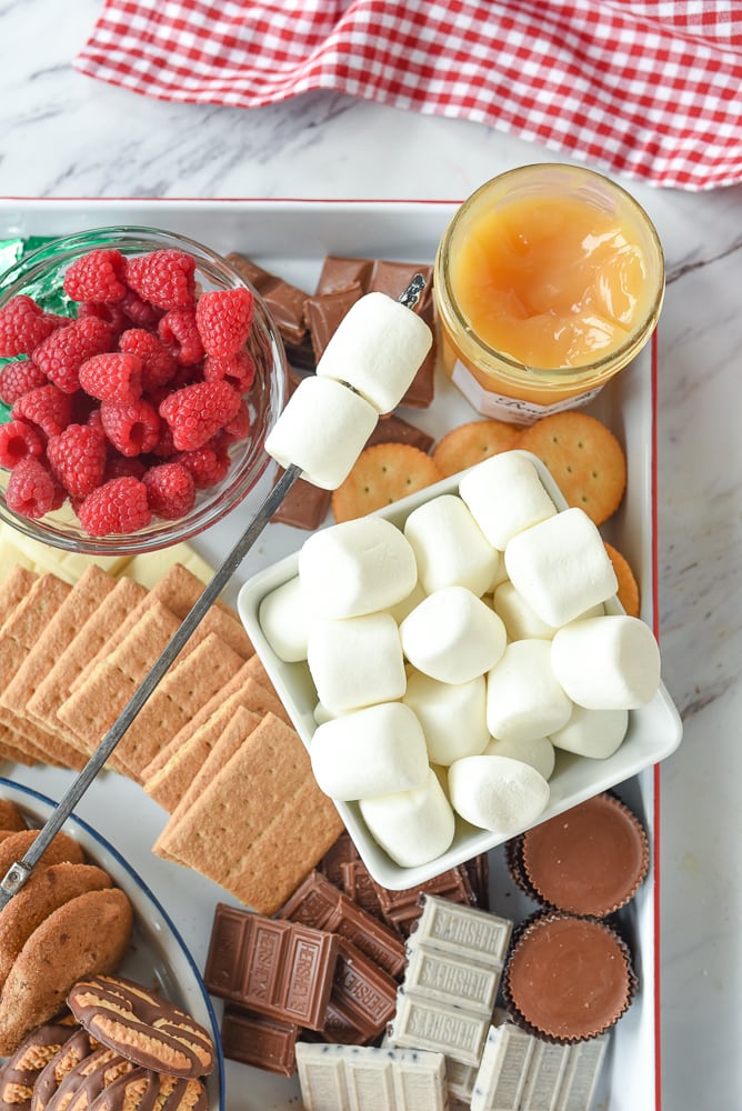 bowl of marshmallows and s'mores board