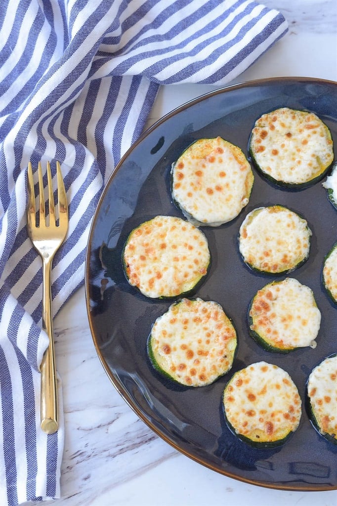 baked zucchini slices topped with mozzarella cheese