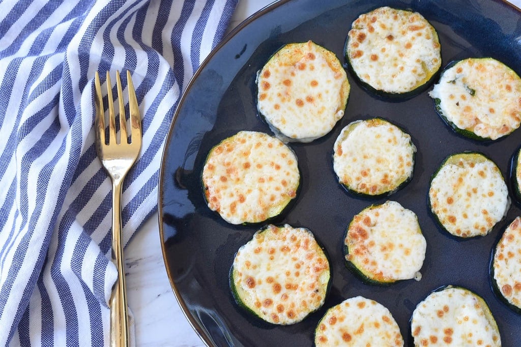 Baked Zucchini with melted mozarella served on a plate