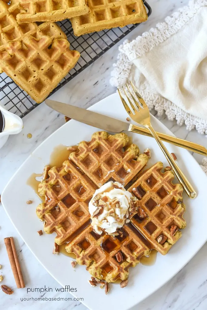 Pumpkin Waffles with whipped cream and pecans