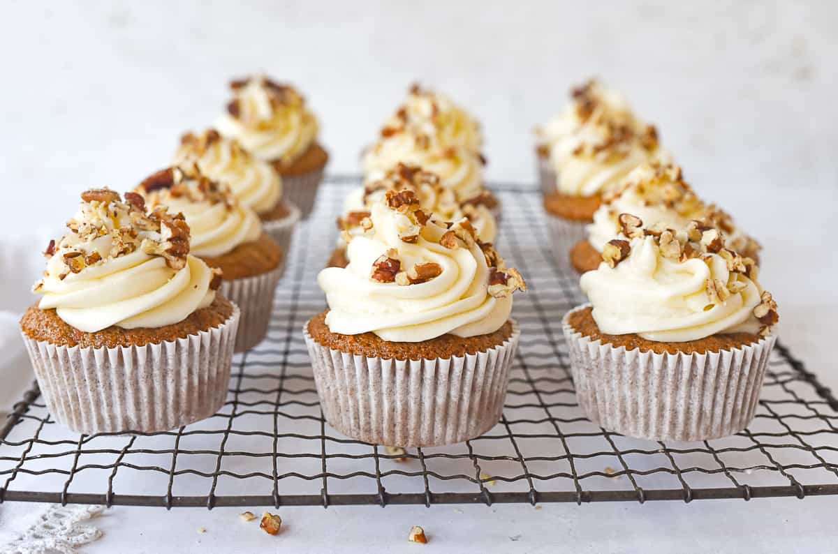 carrot cupcakes on  cooling rack