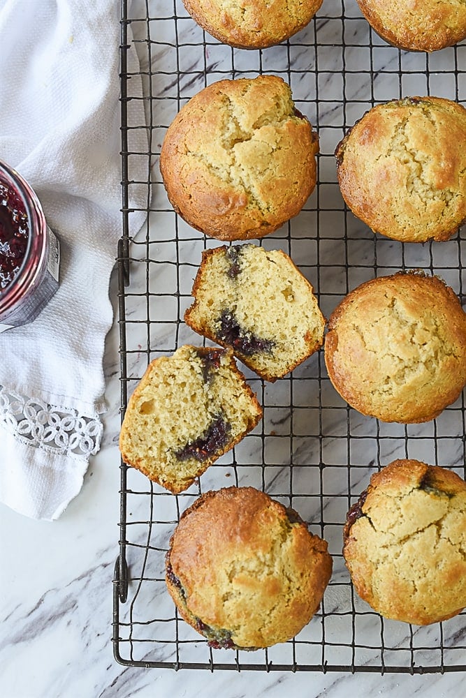 jam muffin broken open on a cooling rack