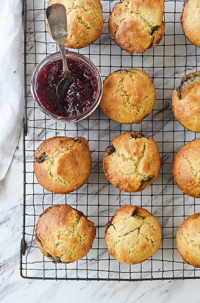 jam and muffins on a cooling rack