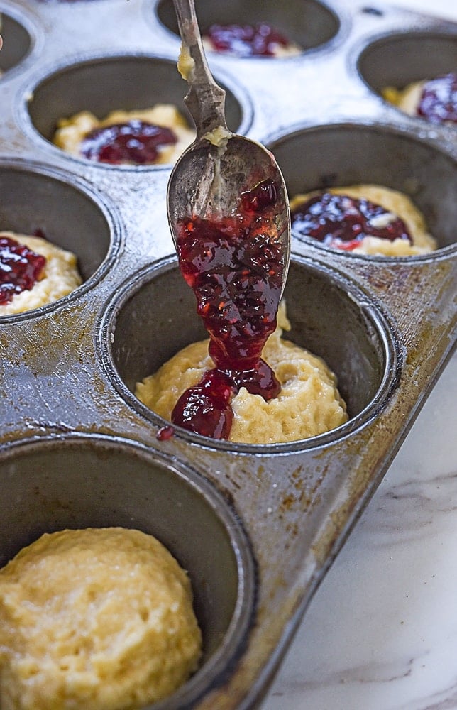 filling muffins with jam