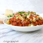 chicken spaghetti with red sauce in a bowl